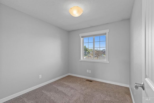 Spare room featuring carpet flooring | Image 21