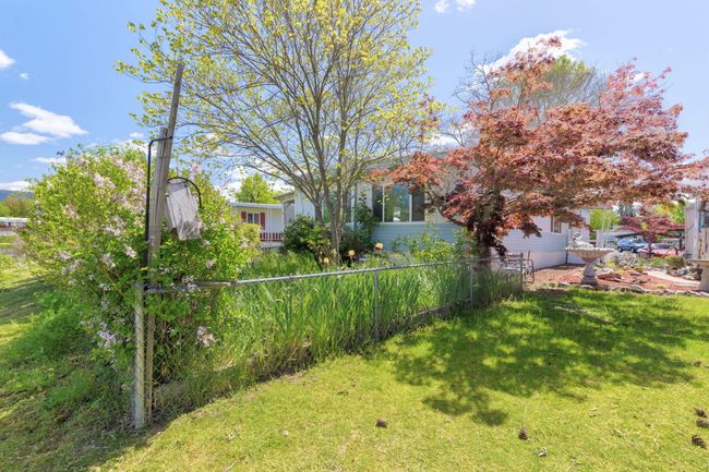 view of fenced backyard | Image 26