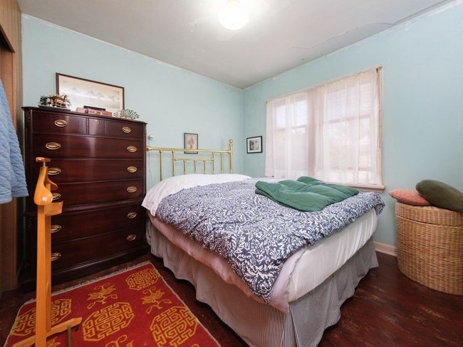 Bedroom with wood finished floors | Image 14
