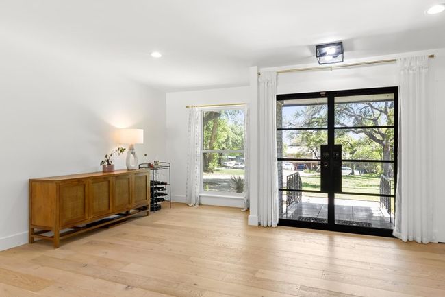 Doorway with recessed lighting, light wood-style flooring, baseboards, and french doors | Image 16