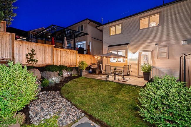 Back of house at twilight with a patio area | Image 29