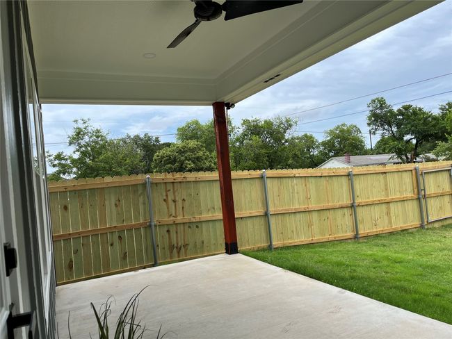 View of patio featuring a ceiling fan | Image 33