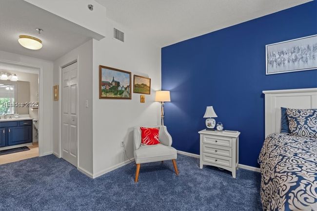 Sitting area in spacious primary suite. | Image 18