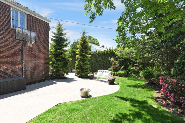 View of yard featuring cooling unit and a patio | Image 19
