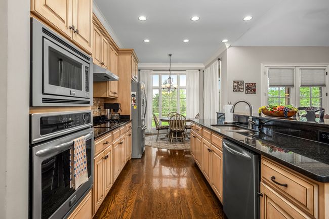 Stainless steel appliances promise efficiency, while a granite countertop provides plenty of workspace. | Image 40
