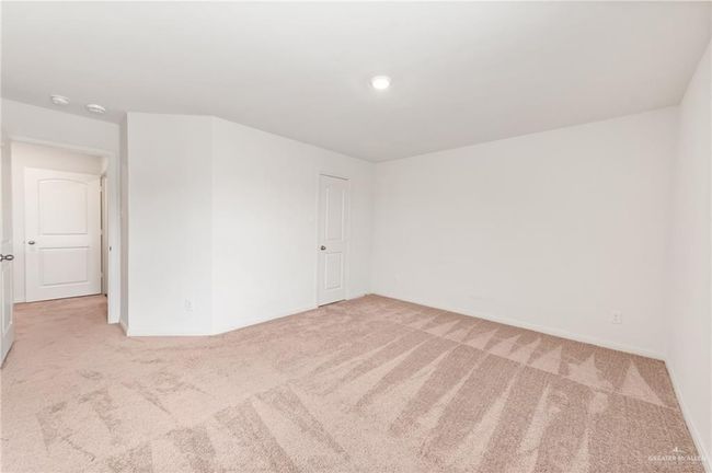 Empty room featuring carpet, baseboards, and a smoke detector | Image 22