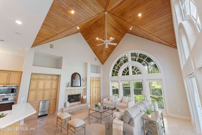 Open concept kitchen to family room with wooded cathedral ceiling. A must see in person! | Image 3