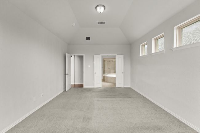 Another view of the primary bedroom with a view into the ensuite bath | Image 15