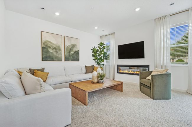 (Photo of decorated model, actual home's finishes will vary) This beautiful great room is both cozy and contemporary! | Image 6
