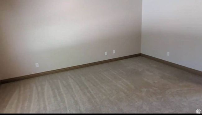 Carpeted spare room featuring baseboards | Image 25