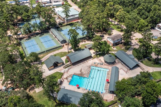 Aerial photo showcases the community recreation area. The large swimming pool and multiple sports courts make this the ideal neighborhood for active living and family-friendly activities. | Image 41