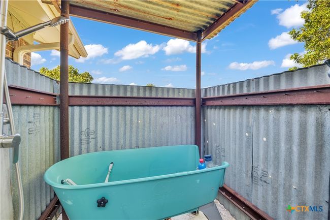 Outdoor shower and dog bath area | Image 48