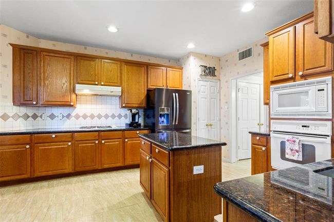 Kitchen- view leading to laundry room and 1/2 bath | Image 9