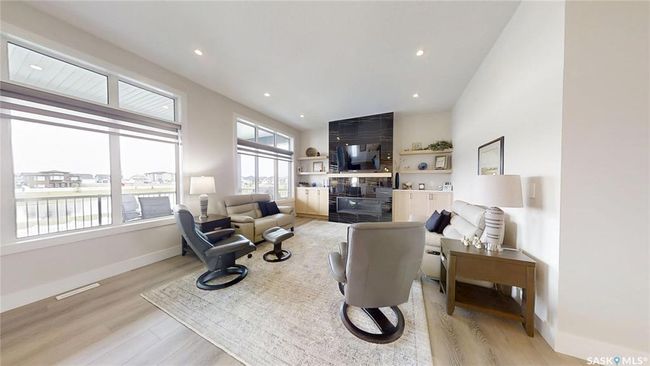 Living room featuring light wood finished floors and recessed lighting | Image 6