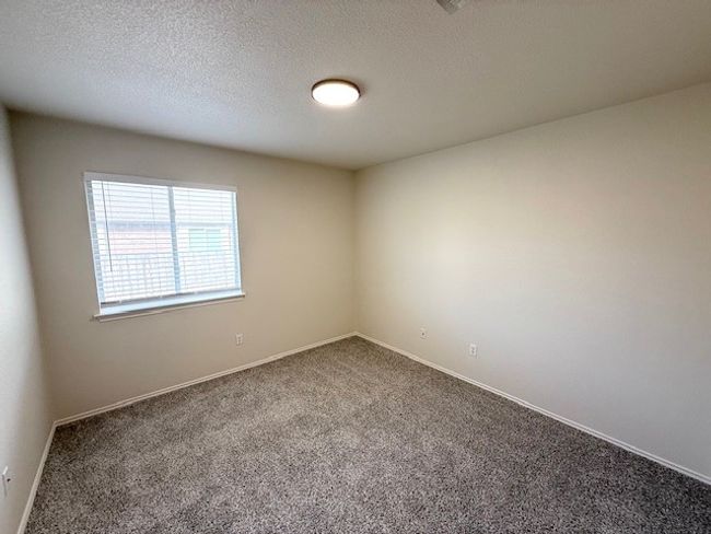 Carpeted spare room with baseboards and a textured ceiling | Image 6