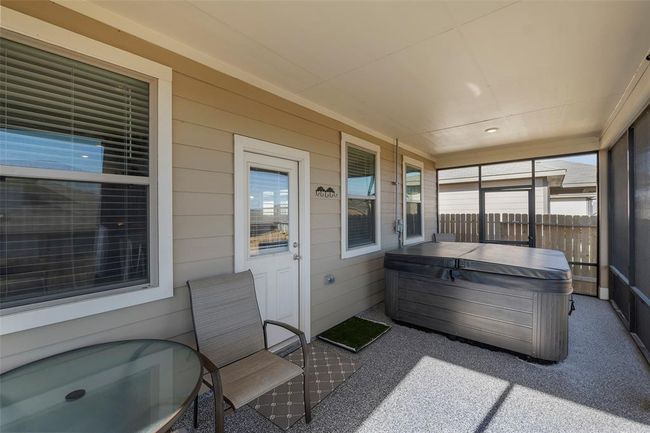 Enjoy the hot tub in your enclosed patio. | Image 30