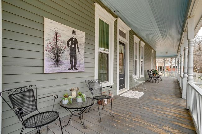 This 1895 Craftsman home featrures a wrap around porch | Image 5