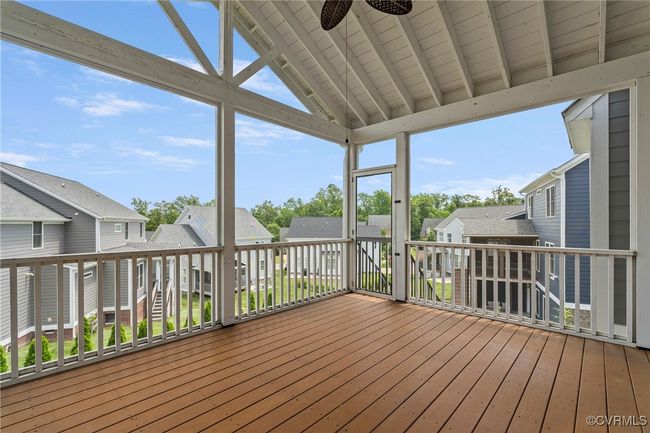 Deck featuring a residential view and a ceiling fan | Image 14