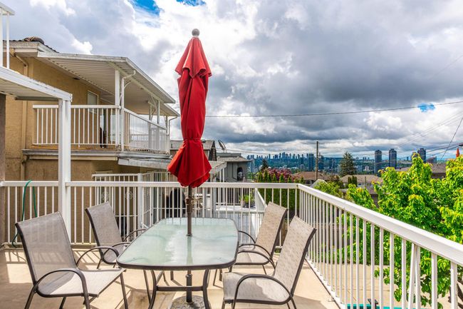 Wooden terrace with outdoor dining area | Image 18