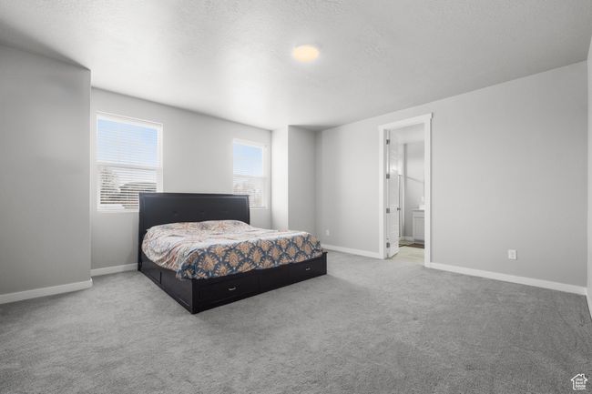 Primary bedroom with ensuite bathroom and walk-in closet | Image 10