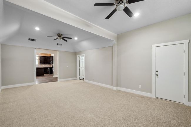 Unfurnished living room with light carpet, ceiling fan, baseboards, and recessed lighting | Image 13