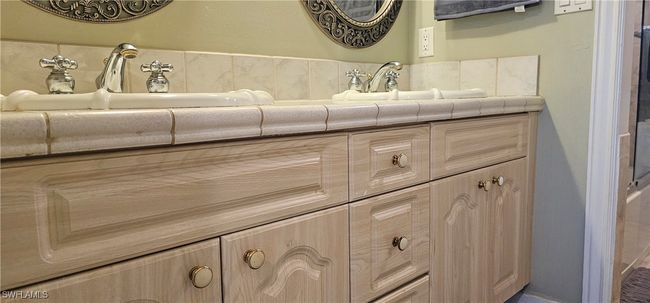 Bathroom featuring vanity | Image 12