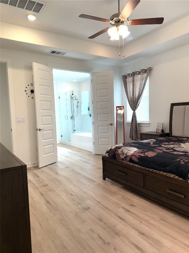 Bedroom featuring light wood finished floors, recessed lighting, and ceiling fan | Image 11