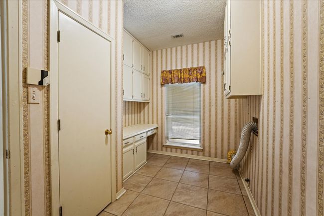 Seperate laundry room with plenty of storage | Image 14