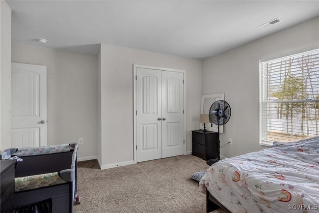 Bedroom with baseboards, visible vents, a closet, and carpet floors | Image 19