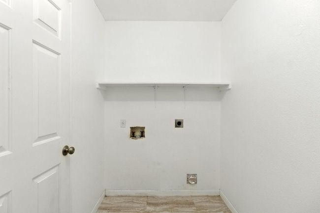 Laundry room /pantry has electric dryer hookup and washer hookup | Image 11