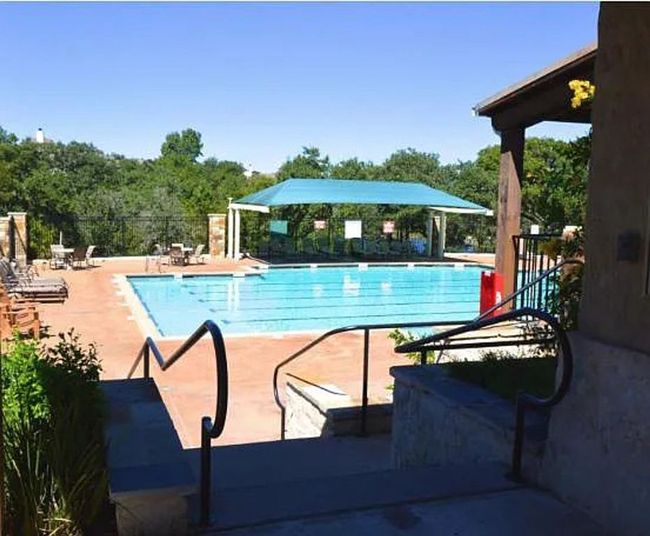Community pool featuring fence and a patio area | Image 40