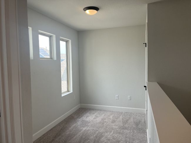 Carpeted spare room with baseboards | Image 4