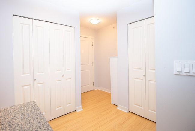 Hallway featuring light wood-style floors and baseboards | Image 6
