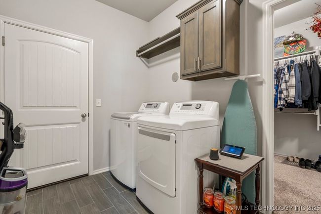 Laundry access to one of the primary bedroom walk in closets | Image 39