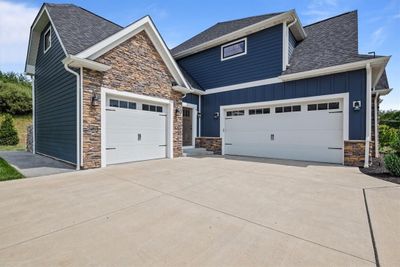 The 3 car garage with 2nd entrance access allows ample space for your cars, bikes, toys and more. The friends and family entrance is so convenient. | Image 2