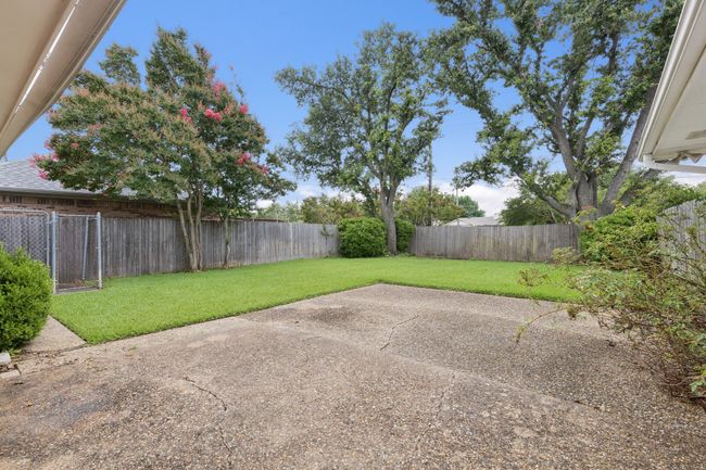 Large grassed backyard with dog run | Image 23