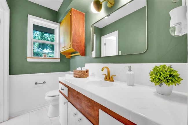 Bathroom with vanity and tile patterned floors | Image 18
