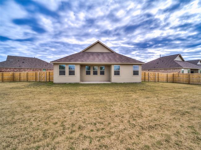 Rear view of house with a patio area | Image 29