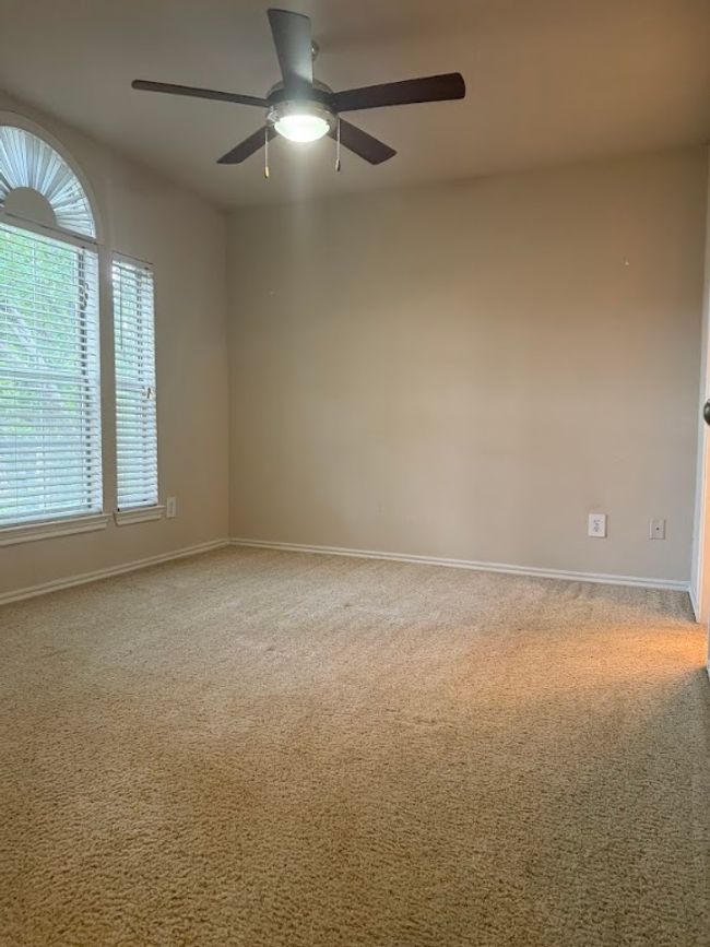 Unfurnished room featuring a ceiling fan and carpet flooring | Image 18