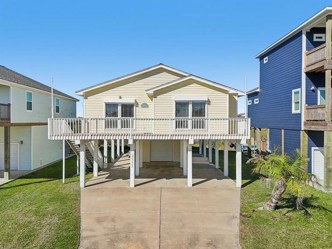 You have a double wide driveway, and garage for your golf cart, and beach toys. | Image 22