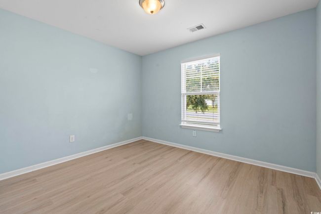 Empty room featuring baseboards and light wood finished floors | Image 14