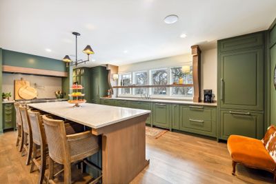 Custom designed kitchen; with dual Thermador fridge/freezer columns, dual Miele dishwashers, Thermador 48" duel fuel range with griddle & 2 ovens + warming drawer. | Image 1