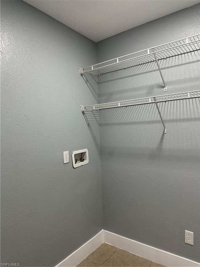 Washroom with washer hookup and tile patterned floors | Image 20