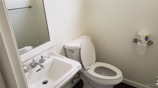 Half bath off of the family room | Image 13