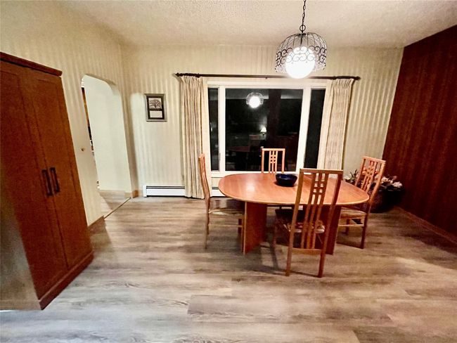 Dining room with laminate flooring | Image 8