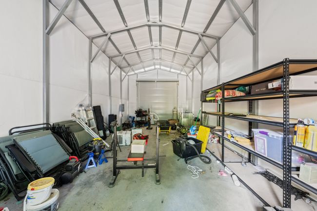 View of garage / metal building with concrete foundation and electricity | Image 29