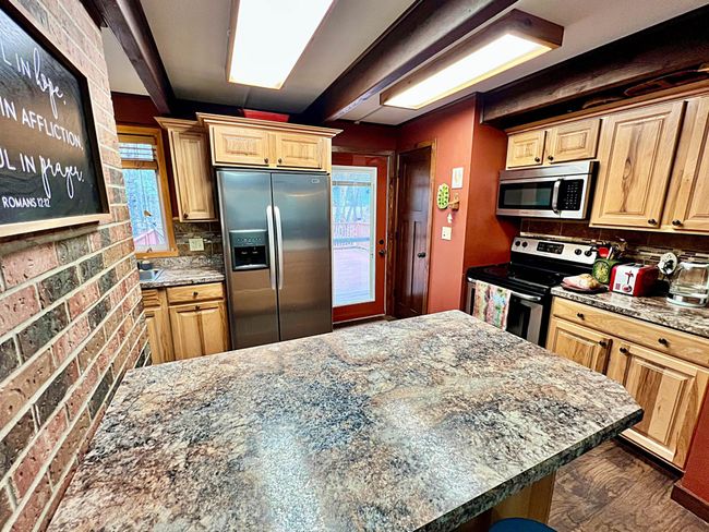 Kitchen eat-in counter space with view to door.jpg | Image 7