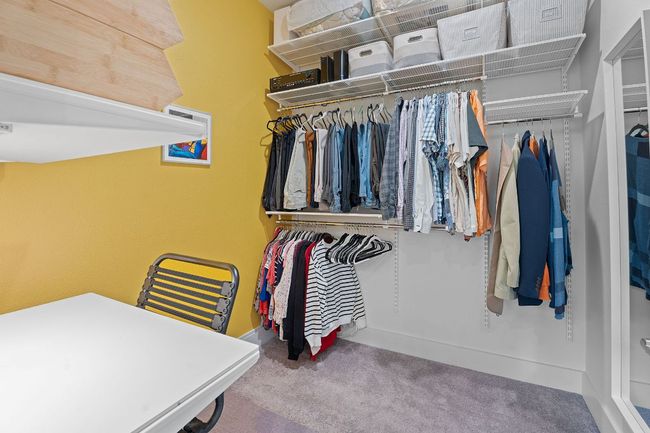 Custom ELFA walk-in closet system in primary bedroom | Image 19