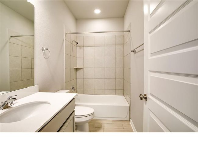 Full bath featuring vanity, shower combination, and recessed lighting | Image 20