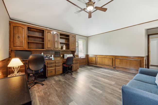 Office Space with Built-in Cabinets that Blend Seamlessly into the Wainscoting | Image 17